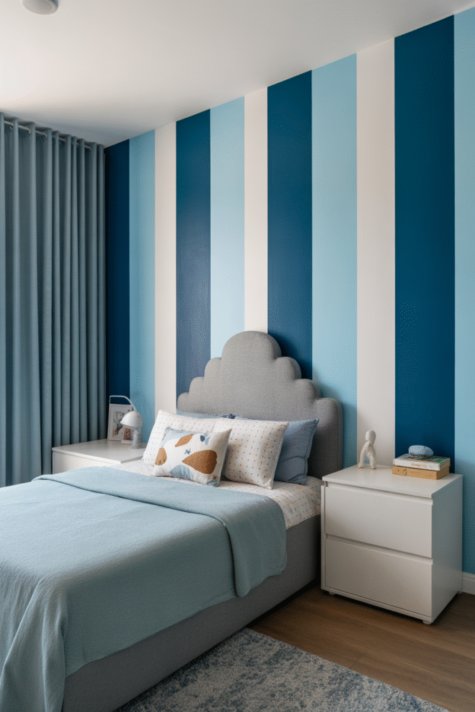 Blue striped accent wall adds playful height and movement to a creative children’s room.