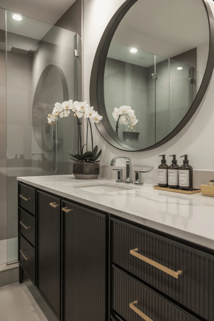 A bold black vanity with white countertop adds contrast and luxury to a bathroom.

