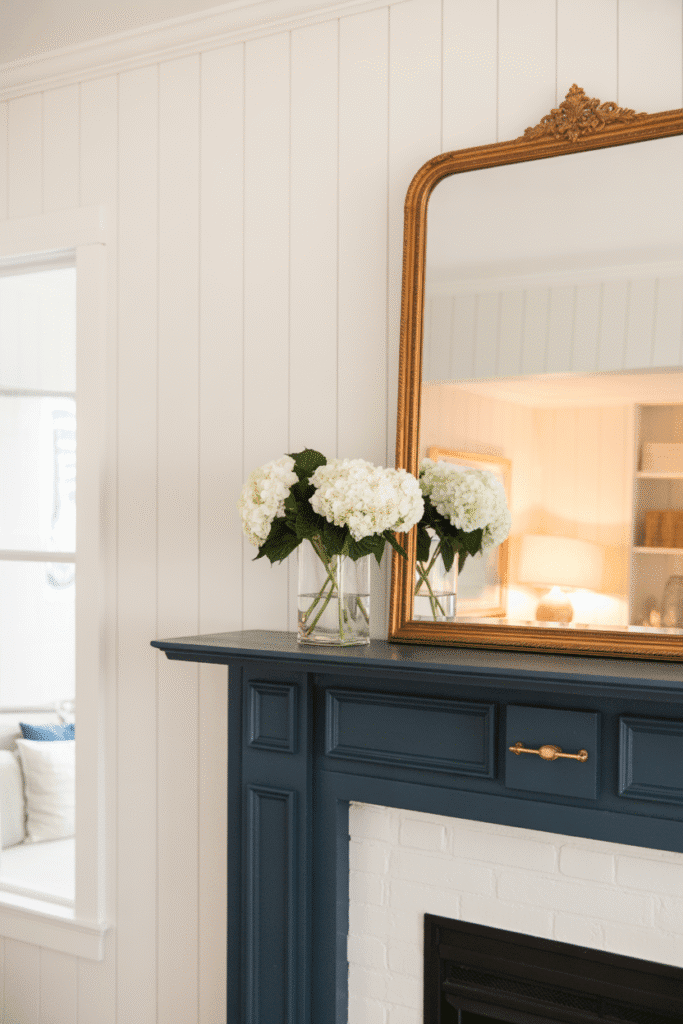 High-contrast fireplace with white board and batten wall and navy mantel.