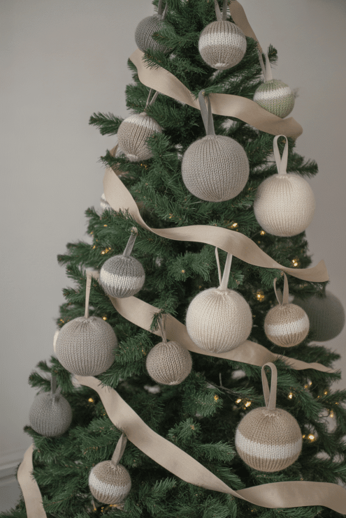 Cozy knit-themed Christmas tree with warm handmade decor.