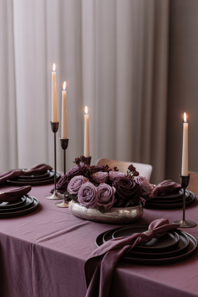 Dramatic Thanksgiving table with dark plum and black accents.