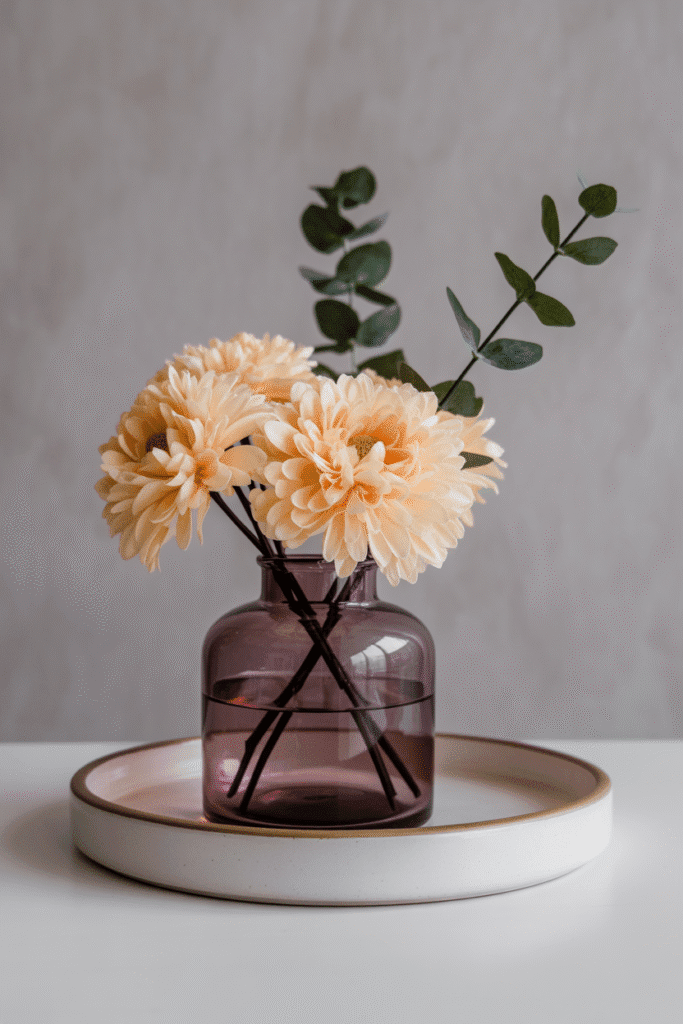 Simple fall floral tray with warm blooms and natural textures.

