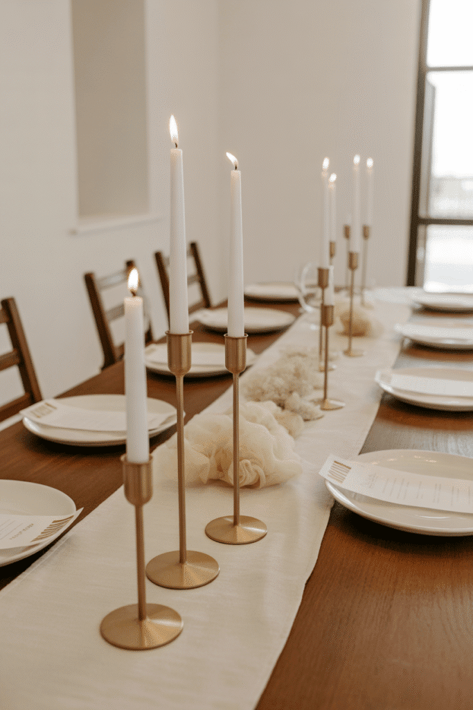 Elegant fall table with cream runner and gold accent pieces.