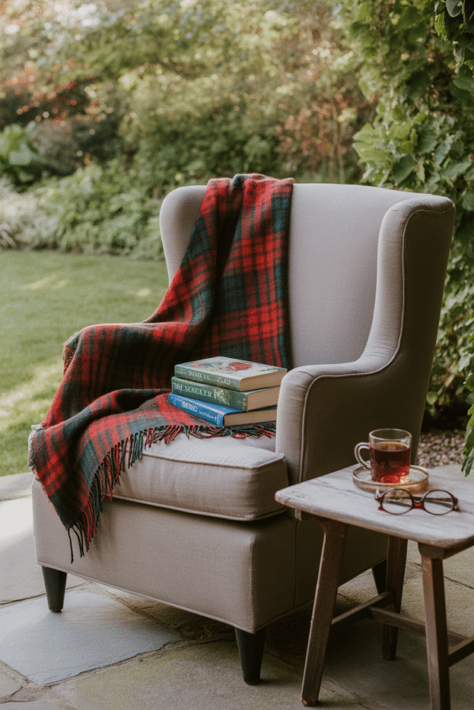 Fall reading chair outdoors with side table and warm decor.