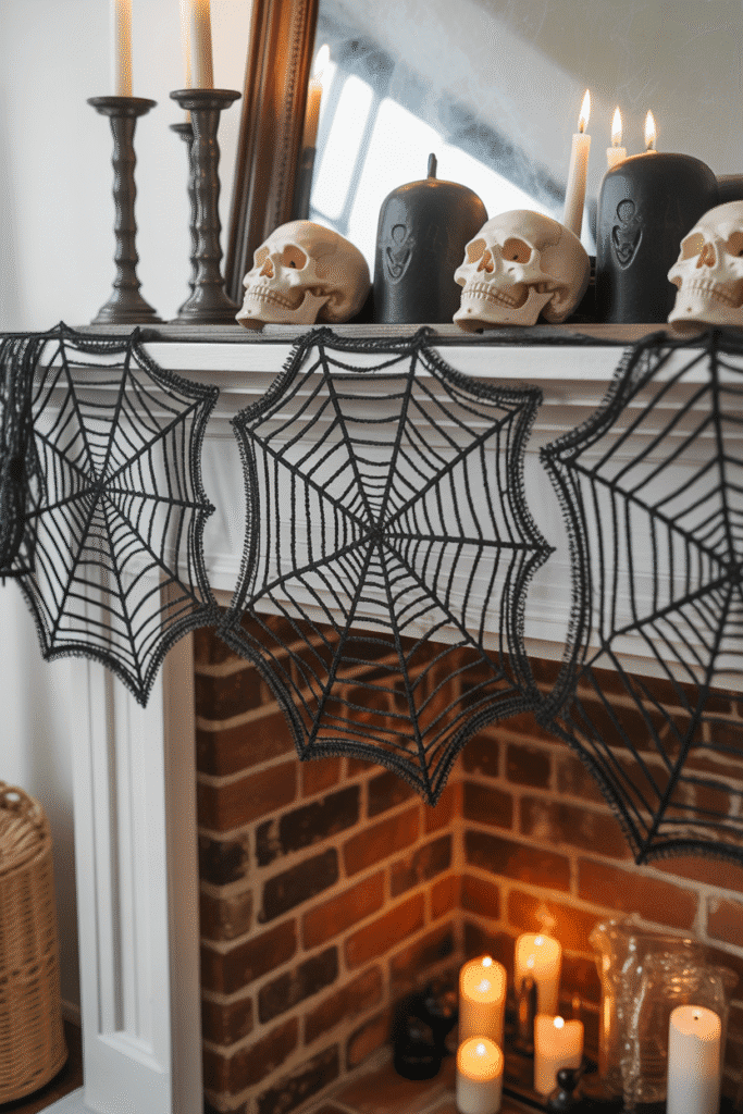 Halloween mantel runner with black spiderweb lace and spooky decor