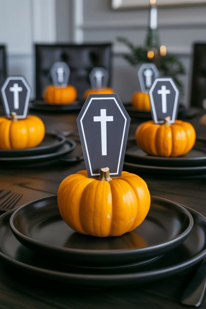 Spooky name cards on Halloween dining table featuring bats and mini pumpkins