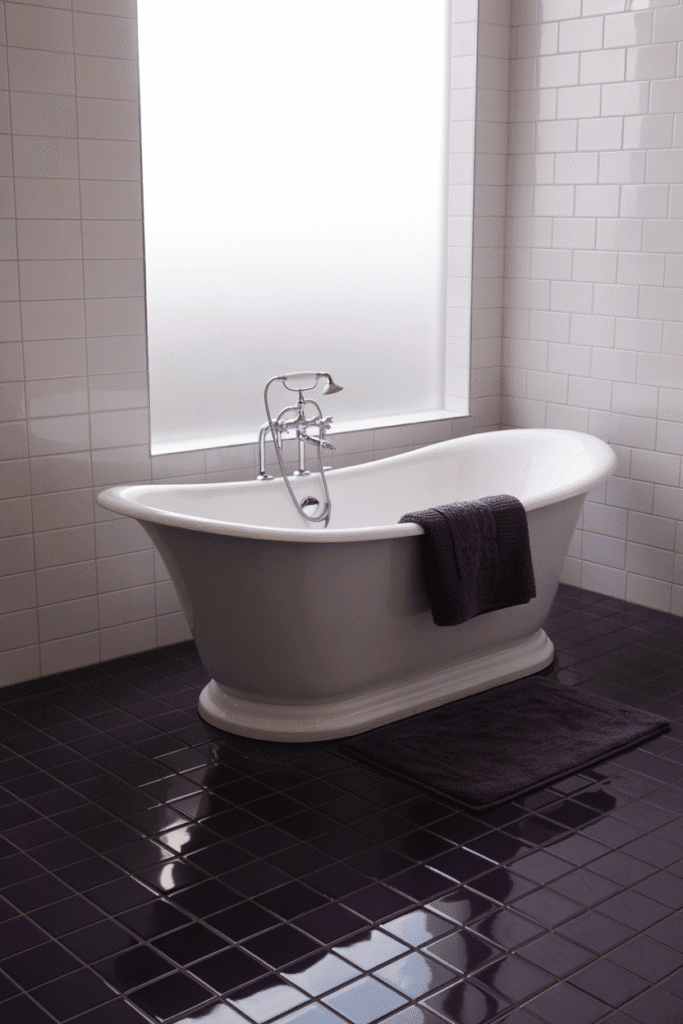 Bold eggplant tile flooring adds contrast and sophistication to a neutral-toned bathroom.
