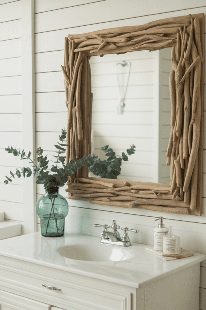 Driftwood-framed mirror in coastal bathroom décor.