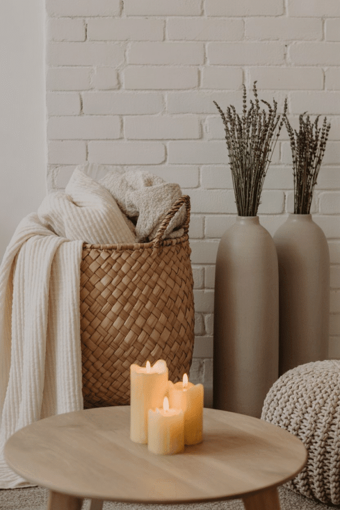 Mid-century modern living room sideboard with woven baskets, candles, and ceramics.